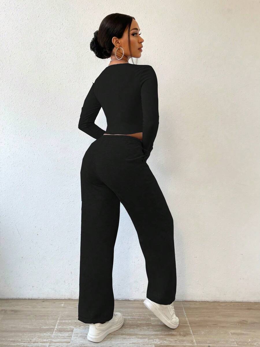 Solid Color Round Neck Top With Exposed Stitching And Waist Belt & Pocket Detail Pants shein