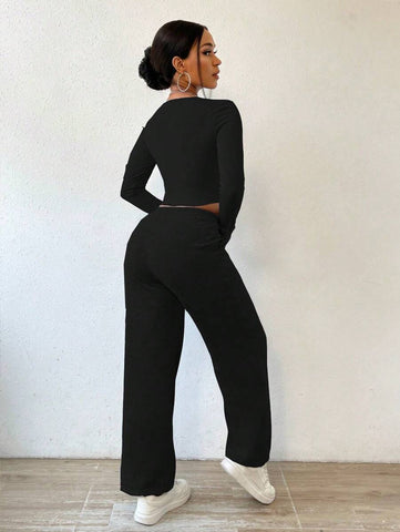 Solid Color Round Neck Top With Exposed Stitching And Waist Belt & Pocket Detail Pants