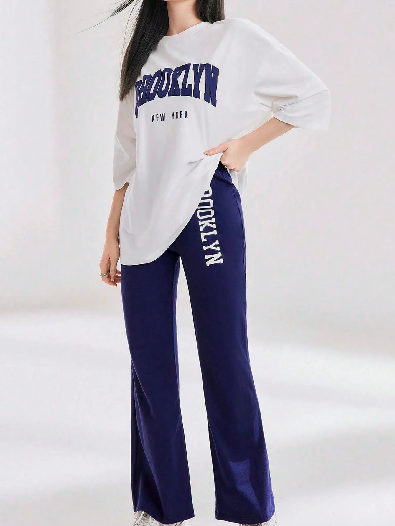 Mulvari Women Spring/Summer Casual Loose Fit Drop Shoulder Short Sleeve Top And Flared Pants Set shein