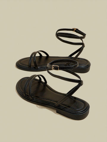 Women's Black Flat Sandals With Crossed Straps & Tie-Up Laces