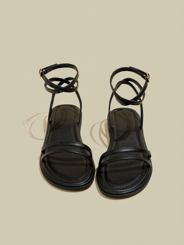 Women's Black Flat Sandals With Crossed Straps & Tie-Up Laces