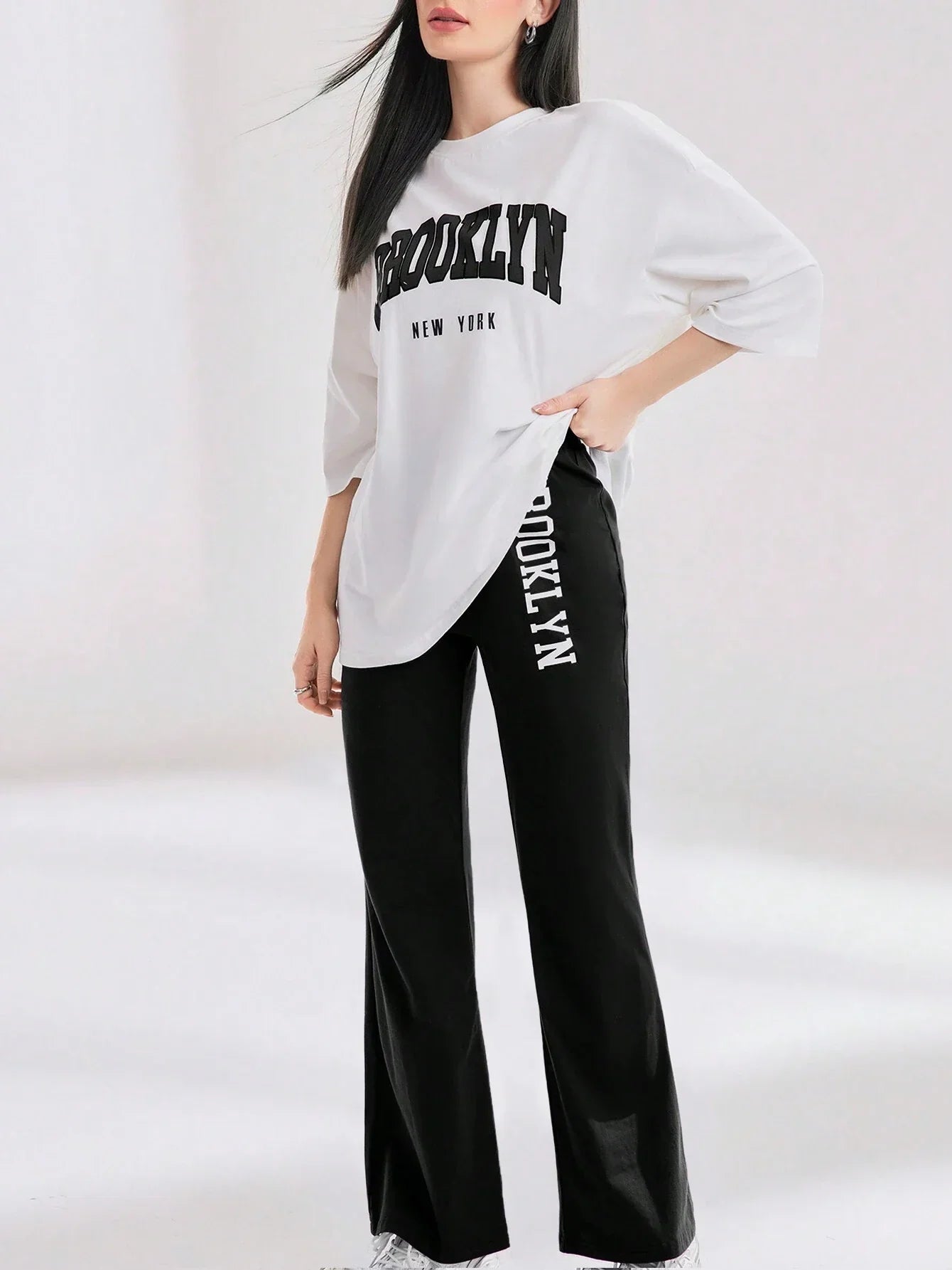 Mulvari Women Spring/Summer Casual Loose Fit Drop Shoulder Short Sleeve Top And Flared Pants Set shein