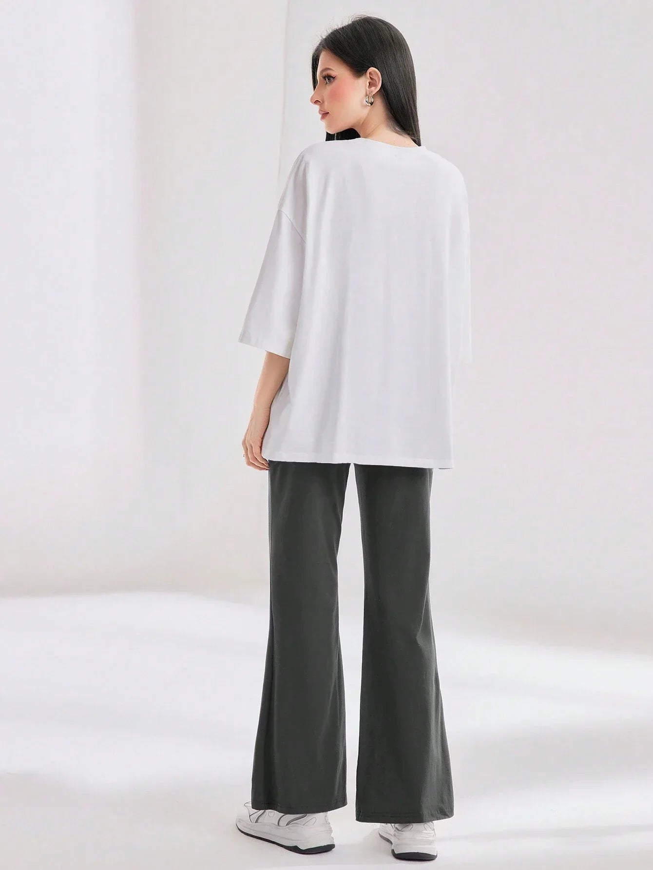 Mulvari Women Spring/Summer Casual Loose Fit Drop Shoulder Short Sleeve Top And Flared Pants Set shein