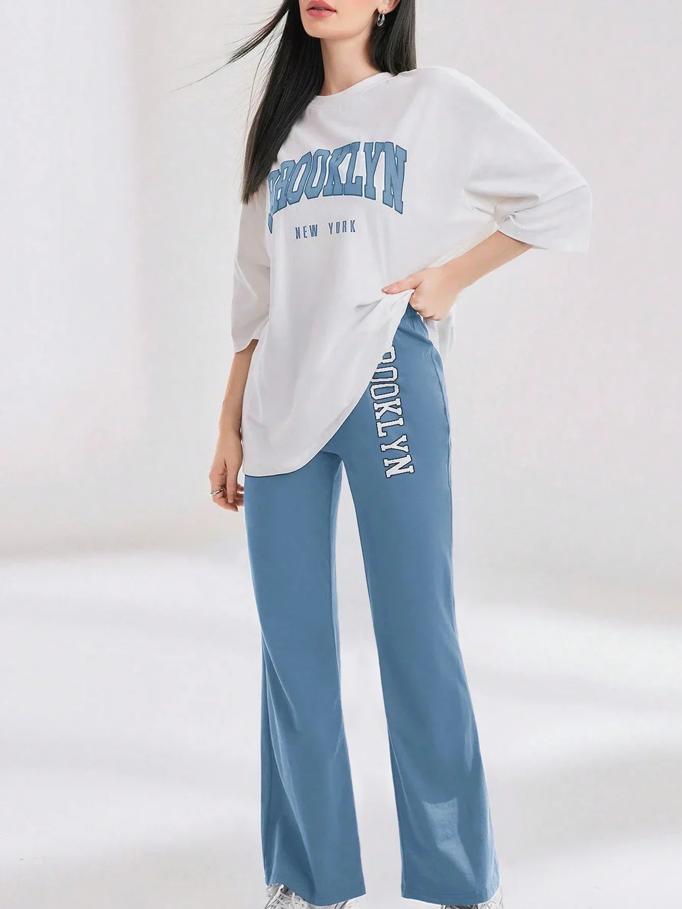 Mulvari Women Spring/Summer Casual Loose Fit Drop Shoulder Short Sleeve Top And Flared Pants Set shein