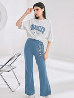 Mulvari Women Spring/Summer Casual Loose Fit Drop Shoulder Short Sleeve Top And Flared Pants Set shein