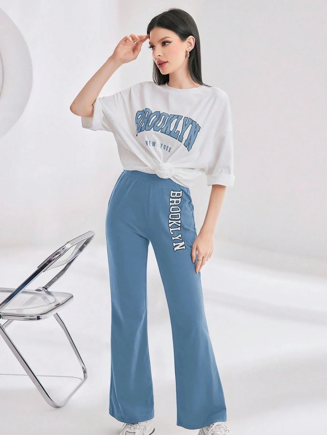 Mulvari Women Spring/Summer Casual Loose Fit Drop Shoulder Short Sleeve Top And Flared Pants Set shein