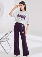 Mulvari Women Spring/Summer Casual Loose Fit Drop Shoulder Short Sleeve Top And Flared Pants Set shein