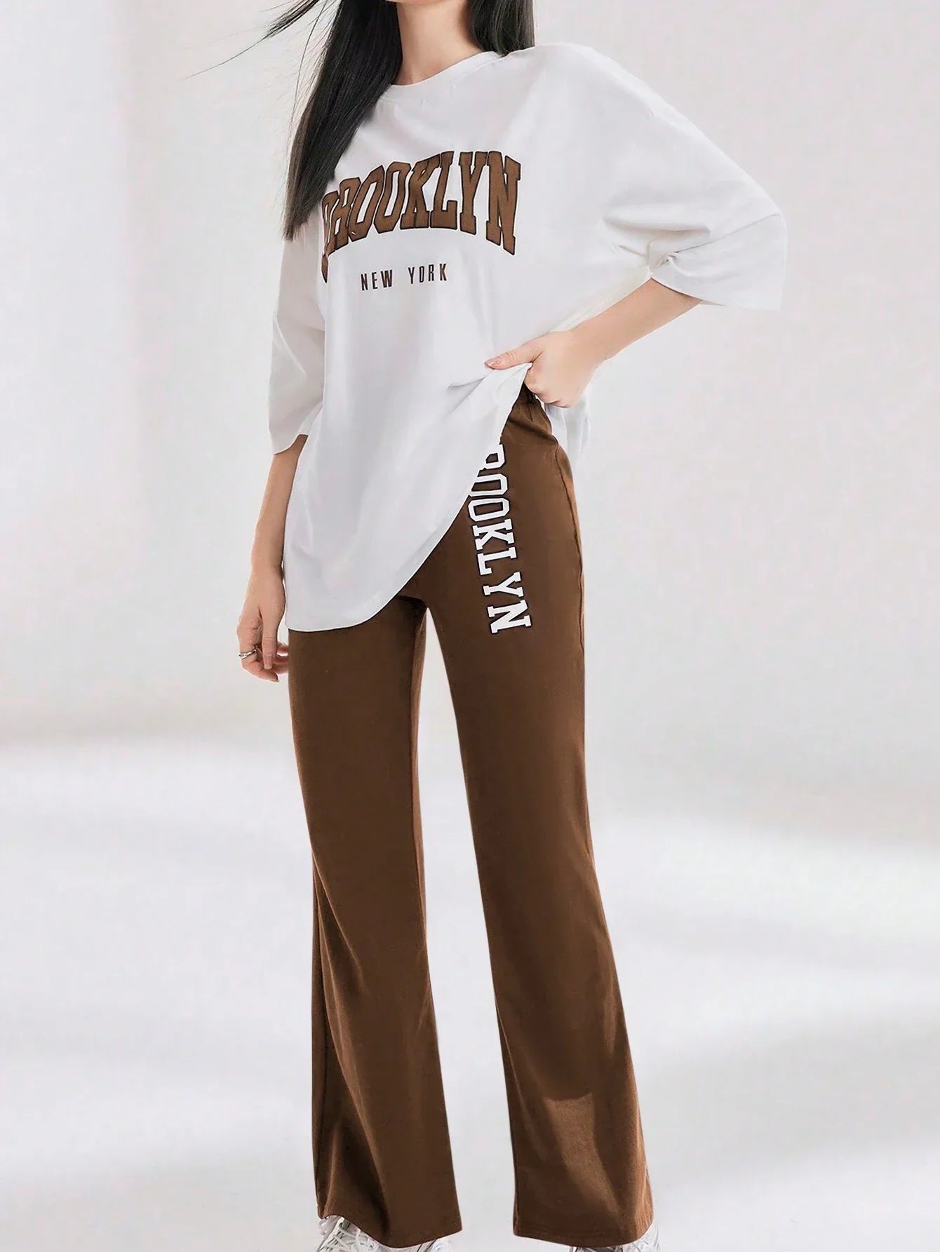 Mulvari Women Spring/Summer Casual Loose Fit Drop Shoulder Short Sleeve Top And Flared Pants Set shein