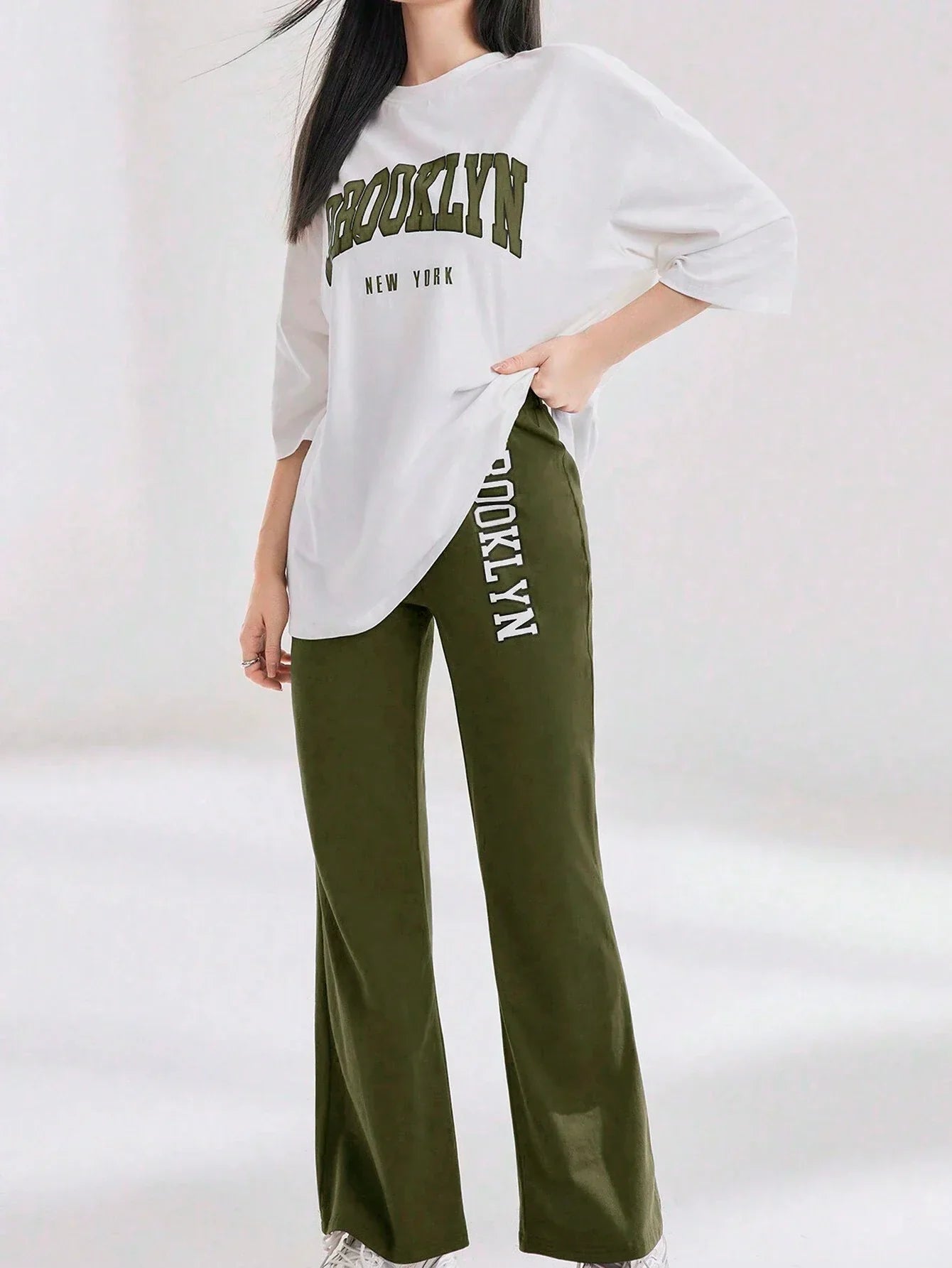 Mulvari Women Spring/Summer Casual Loose Fit Drop Shoulder Short Sleeve Top And Flared Pants Set shein