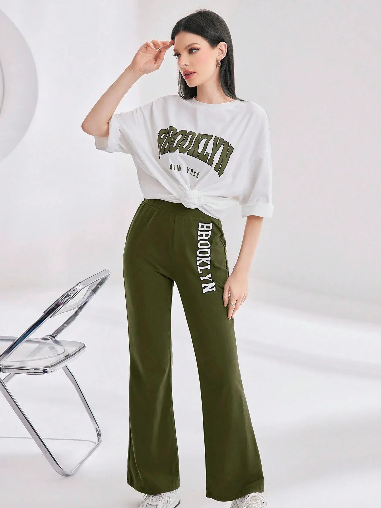 Mulvari Women Spring/Summer Casual Loose Fit Drop Shoulder Short Sleeve Top And Flared Pants Set shein