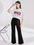 Mulvari Women Spring/Summer Casual Loose Fit Drop Shoulder Short Sleeve Top And Flared Pants Set shein