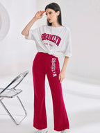 Mulvari Women Spring/Summer Casual Loose Fit Drop Shoulder Short Sleeve Top And Flared Pants Set shein