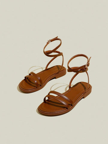 Women's Black Flat Sandals With Crossed Straps & Tie-Up Laces