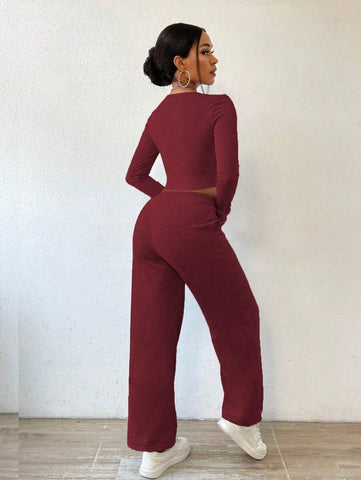 Solid Color Round Neck Top With Exposed Stitching And Waist Belt & Pocket Detail Pants