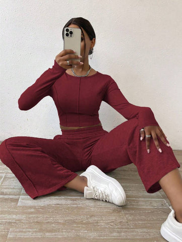Solid Color Round Neck Top With Exposed Stitching And Waist Belt & Pocket Detail Pants