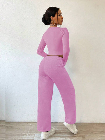 Solid Color Round Neck Top With Exposed Stitching And Waist Belt & Pocket Detail Pants