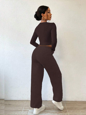 Solid Color Round Neck Top With Exposed Stitching And Waist Belt & Pocket Detail Pants