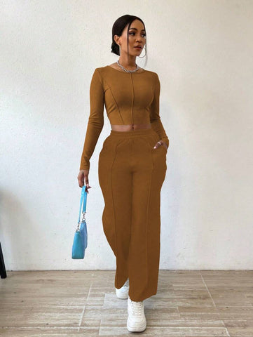 Solid Color Round Neck Top With Exposed Stitching And Waist Belt & Pocket Detail Pants