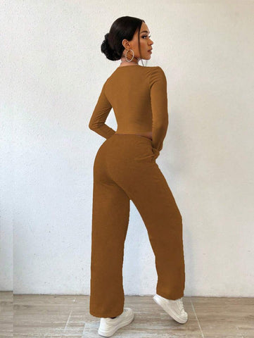 Solid Color Round Neck Top With Exposed Stitching And Waist Belt & Pocket Detail Pants