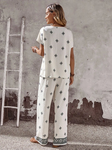 Women Solid Color Round Neck Short Sleeve Top And Flower Print Wide Leg Pants Set