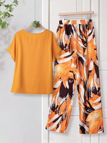 Women Solid Color Round Neck Short Sleeve Top And Flower Print Wide Leg Pants Set