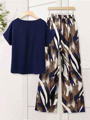 Women Solid Color Round Neck Short Sleeve Top And Flower Print Wide Leg Pants Set
