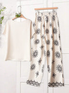 Women Solid Color Round Neck Short Sleeve Top And Flower Print Wide Leg Pants Set shein