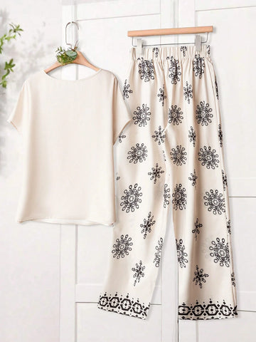Women Solid Color Round Neck Short Sleeve Top And Flower Print Wide Leg Pants Set