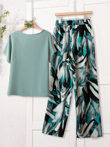 Women Solid Color Round Neck Short Sleeve Top And Flower Print Wide Leg Pants Set
