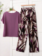 Women Solid Color Round Neck Short Sleeve Top And Flower Print Wide Leg Pants Set shein