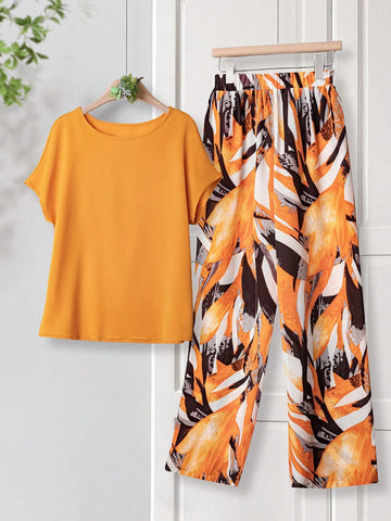 Women Solid Color Round Neck Short Sleeve Top And Flower Print Wide Leg Pants Set