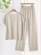 Women Solid Color Round Neck Short Sleeve Top And Flower Print Wide Leg Pants Set shein