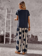 Women Solid Color Round Neck Short Sleeve Top And Flower Print Wide Leg Pants Set shein
