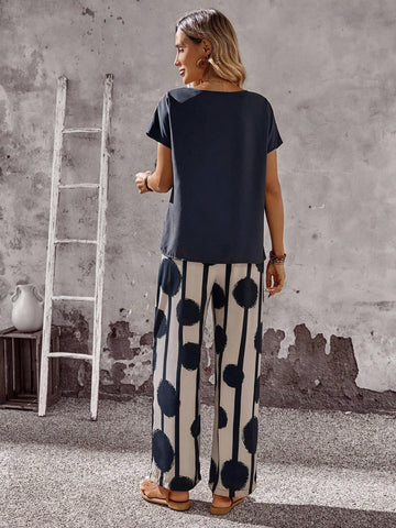 Women Solid Color Round Neck Short Sleeve Top And Flower Print Wide Leg Pants Set