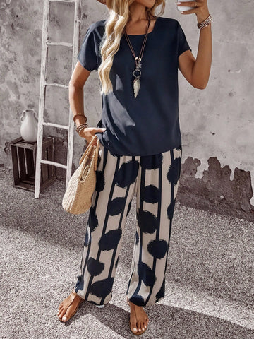 Women Solid Color Round Neck Short Sleeve Top And Flower Print Wide Leg Pants Set
